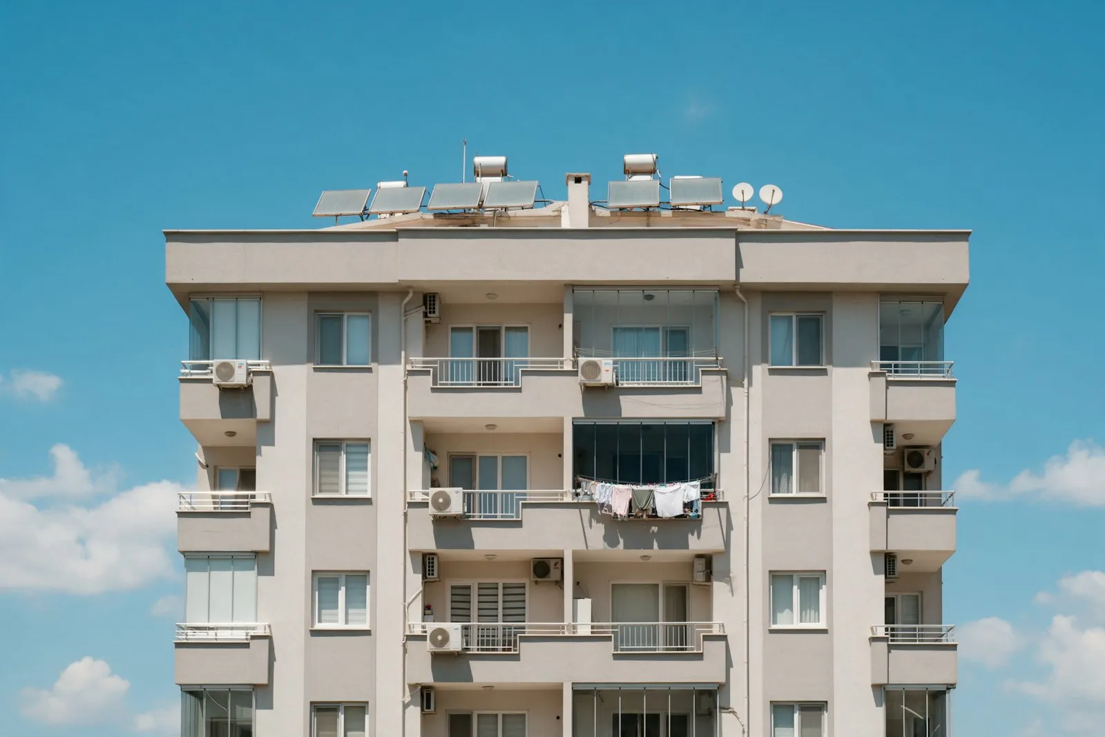 The facade of a residential building in Turkey with air conditioners